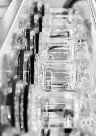 Abstract background with gray glass tubes. Detail of a Soxhlet extractor. Chemical laboratory equipment.の写真素材