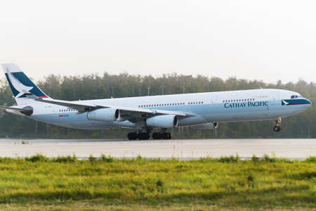 MOSCOW, RUSSIA - SEPTEMBER 26, 2014: Airbus A330 Cathay Pacific take off at Domodedovo international airportのeditorial素材