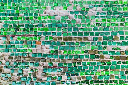 Colored stone and glass mosaic, textured wall.の写真素材