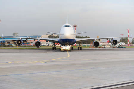 MOSCOW, RUSSIA - SEPTEMBER 26, 2014: Boeing 747 Transaero towed to the runway. Transaero Airlines...
