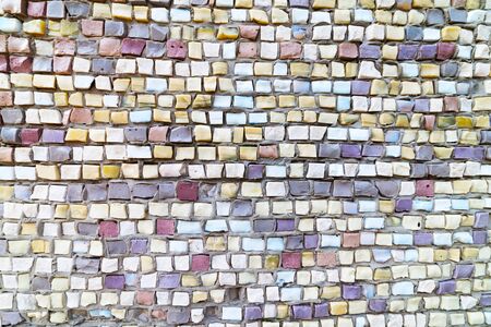 Colored stone and glass mosaic, textured wall.の写真素材