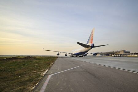 MOSCOW, RUSSIA - SEPTEMBER 26, 2014: Boeing 747 Transaero taxiing to the runway. Transaero Airlines has ceased to exist in 2015.のeditorial素材