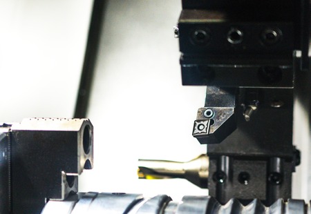 Cutters for metal et the CNC machine tool magazine. Metal shavings.