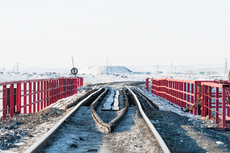 Railway bridge and deformation of the railway track, built on permafrost. Polar tundra, Russia.の写真素材