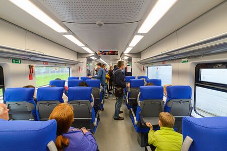 MOSCOW, RUSSIA - SEPTEMBER 11, 2016: Passengers in the car of a passenger train. September 10, 2016 at the Central Railway Moscow Ring Road started passenger services.のeditorial素材