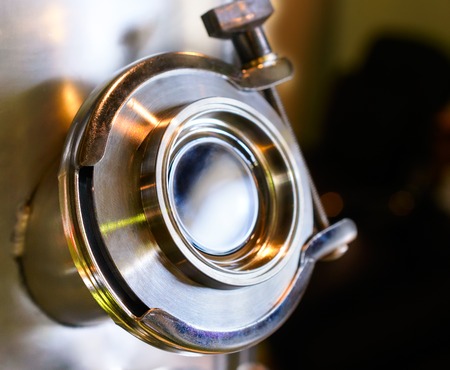 The viewing window of the gas chamber, laboratory equipment. Shallow depth of field.