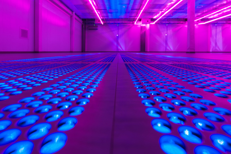 Ventilation holes in the floor of an empty server room.の写真素材