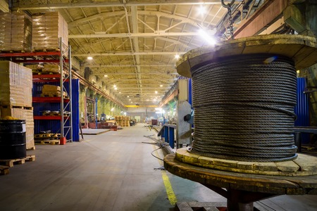 Warehouse industrial enterprise. The storage of steel coils of rope.