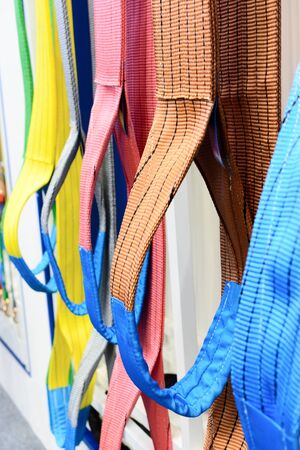 Multicolored nylon soft lifting slings. Warehouse of finished products for industrial enterprisesの写真素材