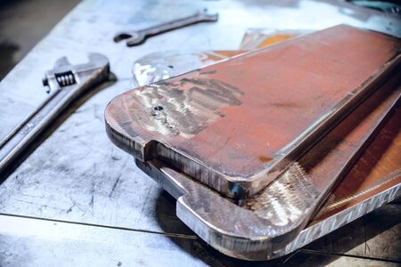 Adjustable and open-end wrenches. Steel metal plate stacked. Abstract industrial background.の写真素材