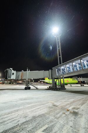 Moscow region, Domodedovo, Russia - December 15, 2016: Telescopic ladders Domodedovo International Airport. Winter Night Sceneのeditorial素材