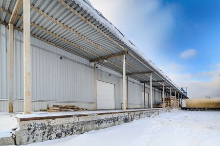 Empty truck docks at a warehouse.