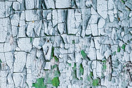 old, weathered boards with peeling paint.の写真素材