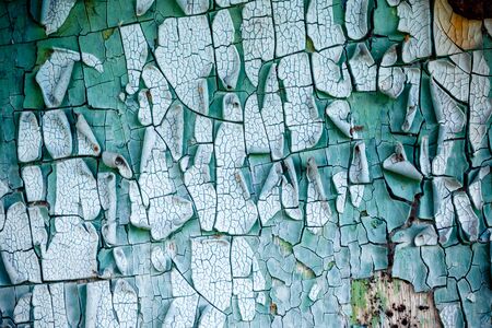 old, weathered boards with peeling paint.の写真素材