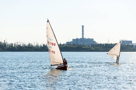 Windsurfers are trained on a large lake.のeditorial素材