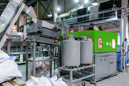 The machine for blowing plastic PET bottles.
