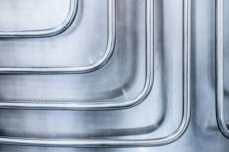 Thin steel tubes curved at right angles.の写真素材