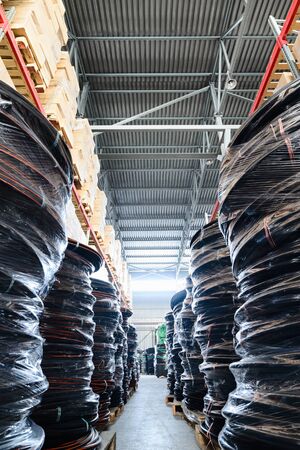 Long shelves with a variety of boxes and containers.の写真素材