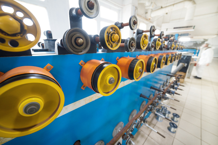 Rotating rubberized wheels of the winding machine.の写真素材
