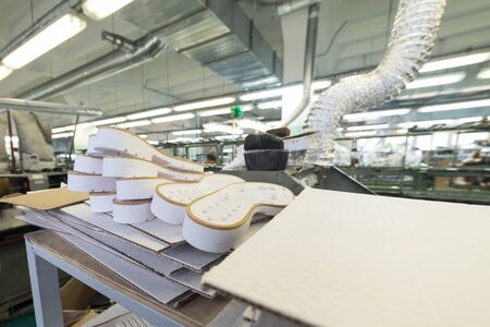 A stack of white shoe soles.の写真素材