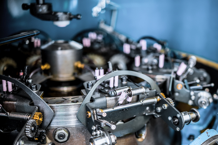 The mechanism of a braiding machine close-up.の写真素材