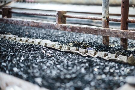 Industrial tinning of wire. Bath with molten solderの写真素材