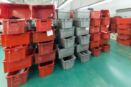 Red and gray plastic boxesの写真素材