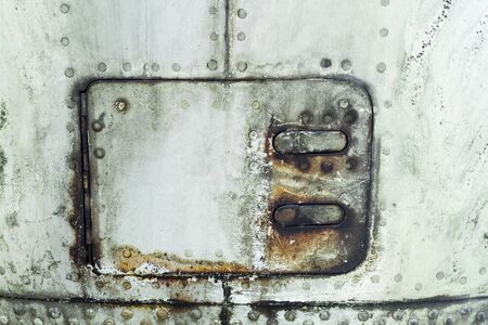Aluminum surface of the aircraft fuselage.