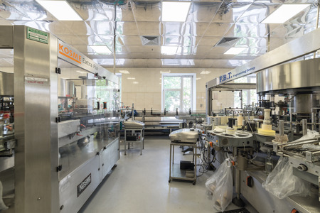 Brest, Belarus - July 05, 2017: Brest Distillery. A machine for applying labels to bottlesのeditorial素材