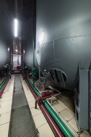 Steel semicircular gray tanks for fermenting the yeast mixture.の写真素材