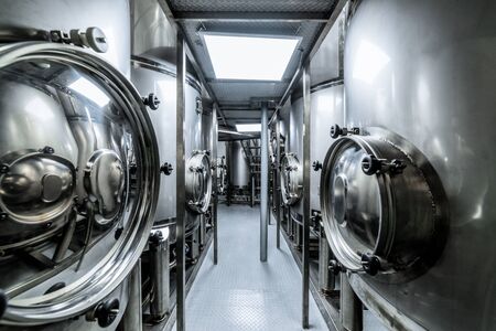 Metal tanks, modern production of alcoholic beverages.の写真素材