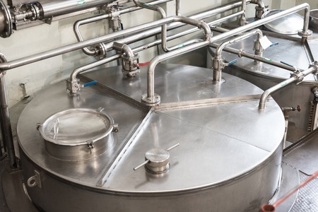Metal cistern with piping system.