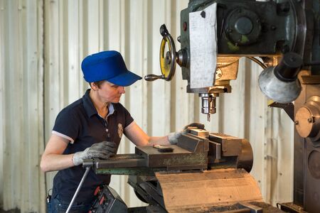 Lipetsk, Russia - June 15, 2017: Lipetsk Machine Tool Plant, A woman at work on a vertical milling...