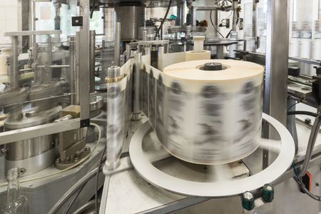 Automatic labeling machine during operation.の写真素材