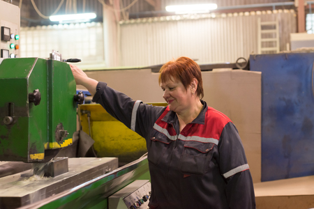 Lipetsk, Russia - June 15, 2017: Lipetsk Machine Tool Plant. A woman works on a grinding machine....
