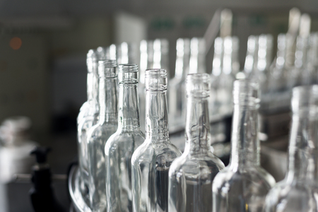 Empty glass bottles on the conveyor.の写真素材