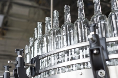 Empty glass bottles on the conveyor.