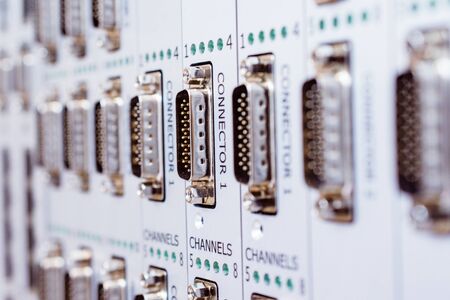 A panel with a lot of multi-pin connectors.の写真素材