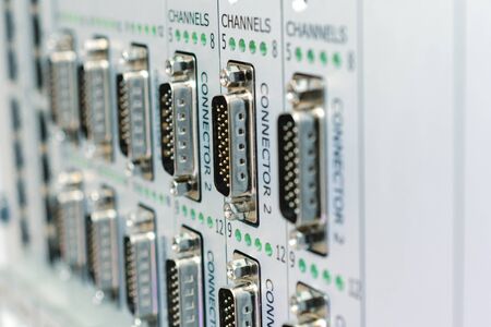 A panel with a lot of multi-pin connectors.の写真素材