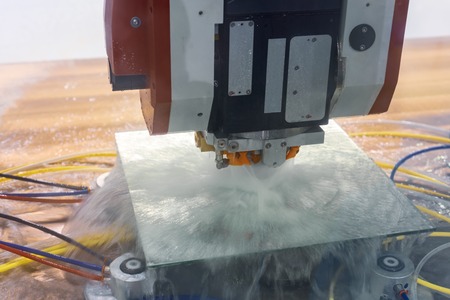 The CNC machine for glass processing polishes the facet on the round mirror. Circular panning from...
