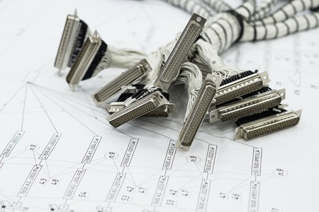 A bundle of cable harnesses lies on the table.