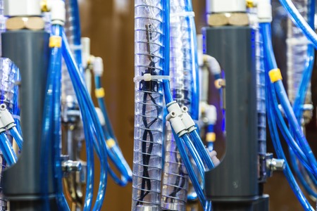 Plenty of plastic pipes, internal device of industrial machine. Abstract industrial background.の写真素材