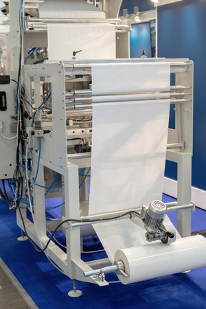Roll of packaging film. Feeding unit of a modern packaging machineの写真素材