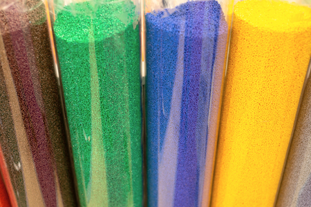 Various granules and powders in clear glass capsules.