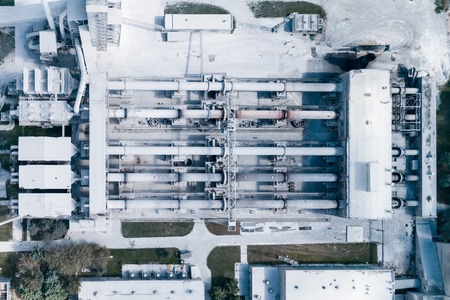 Plant for the production of cement, clinker and gypsum. Tubular rotary kilns. Aerial photography, view vertically downの写真素材