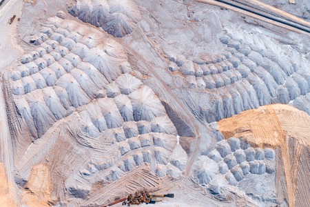 Ore layers, unsuitable for production. Warehousing of rocks with the help of a spreaderの写真素材