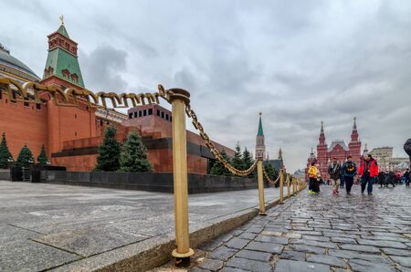 Moscow Red Square. Lenins Mausoleum. Tourists walk around the square