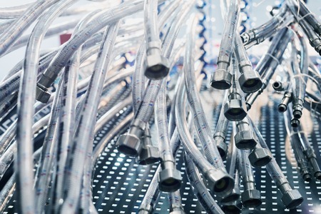 Many flexible water hoses. Selective focus, shallow depth of field