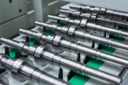 Metal shafts on the CNC conveyor transfer beltの写真素材