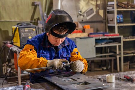 Plant for the assembly and welding of metal structures. Welder during work.のeditorial素材